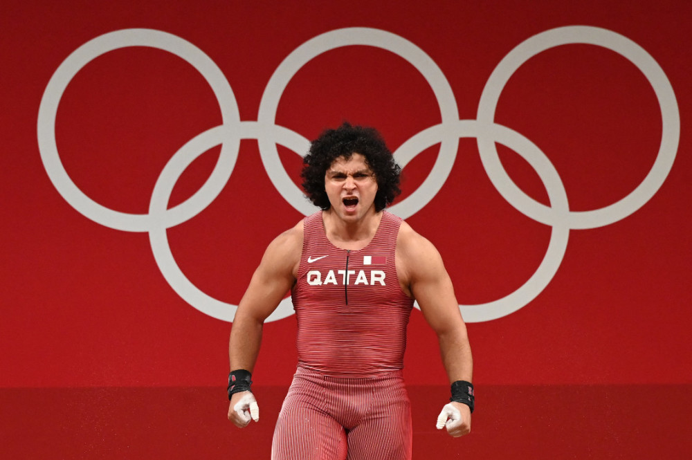 关于意大利举重运动员获得金牌成功的信息